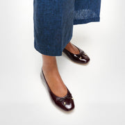 DELICATO Bow Textured Patent-Leather Ballet Flats